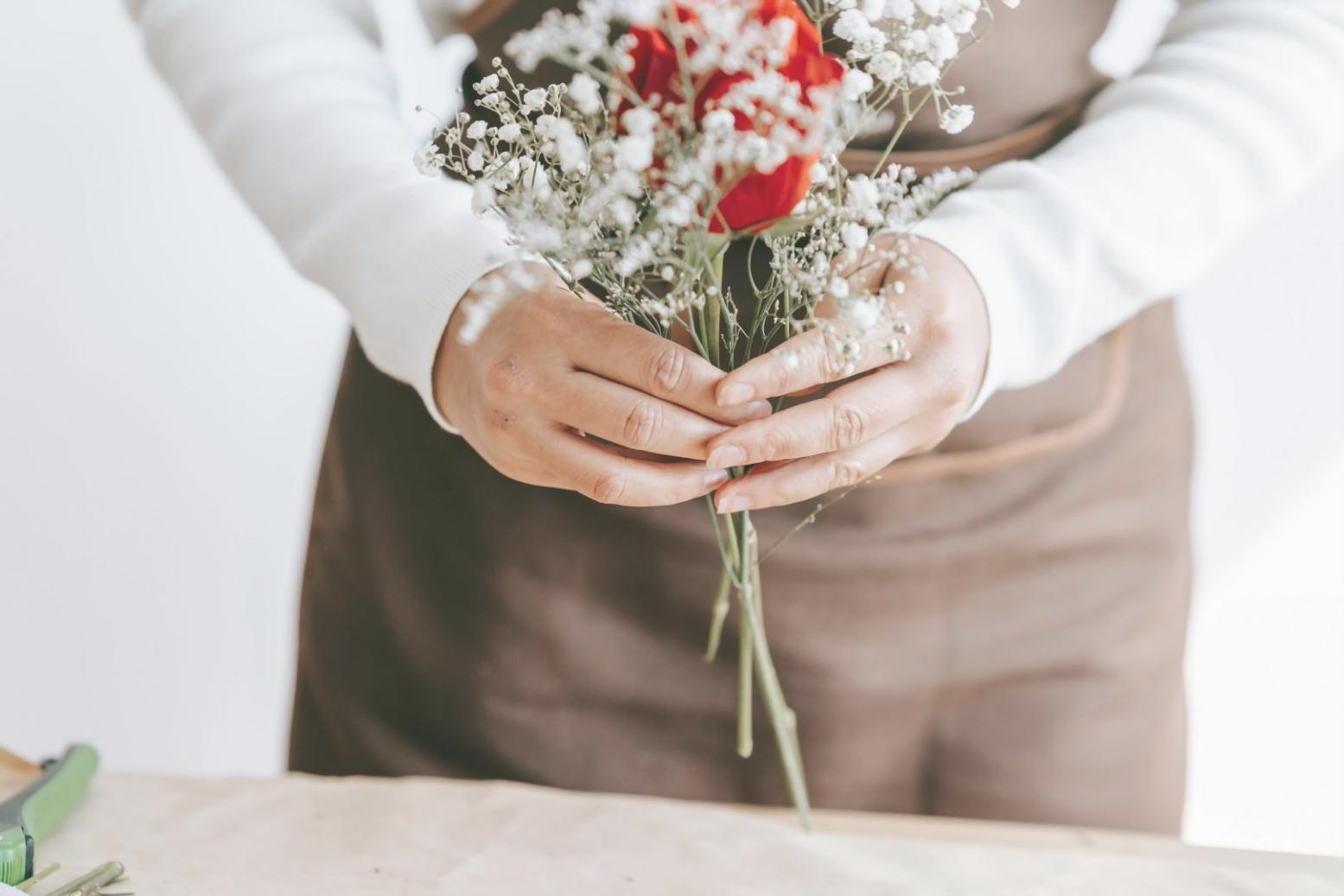 Hands-on floral design instruction session